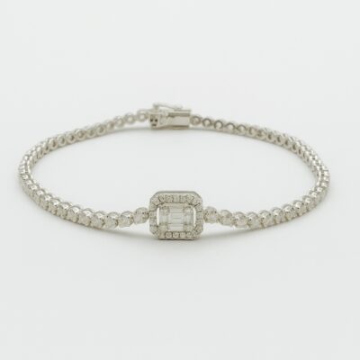 Pulsera tennis en oro blanco con centro cuadrado princesa