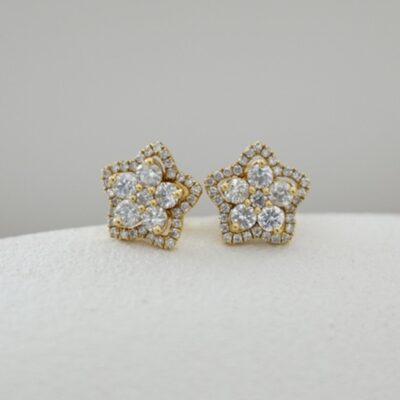 Aretes modelo estrella con brillantes en oro amarillo 18K