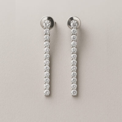 Aretes Tennis largos en Oro Blanco 18K.