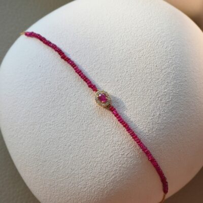 Pulsera de rubíes con borde de diamantes en oro amarillo 18k