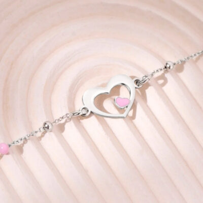 Pulsera corazón calado con centro rosado en plata 925